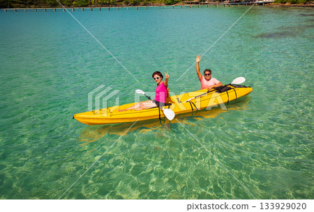 Asian senior couple on kayak in adventure travel in south east asia. 133929020