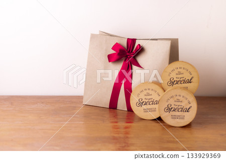 A sweets box and a cute shopper tied with a ribbon A sweets box and a cute shopper tied with a ribbon 133929369
