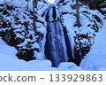 small waterfall in the snow 133929863