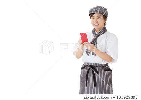 A woman wearing a chef's coat (smartphone, app, word of mouth) A woman wearing a chef's coat (smartphone, app, word of mouth) 133929895