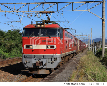 A freight train pulled by EF510 passes through Torahime Station on the Hokuriku Main Line 133930111