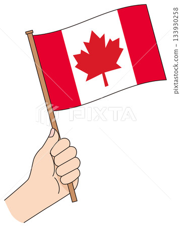 Hand holding a simple flag of Canada 133930258