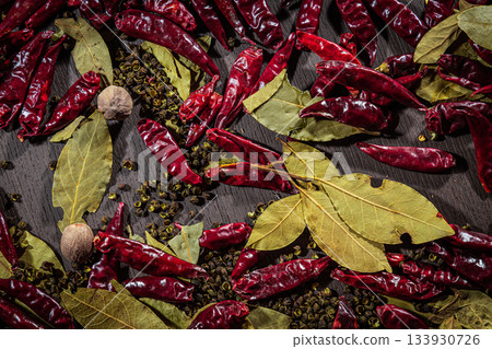 dried red chili peppers on the ground 133930726