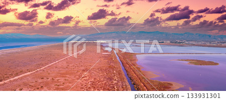 Salty lake in Cabo de Gata Reserve at sunset. Las Salinas de Cabo de Gata. Aerial view. Almeria, Spain. Horizontal banner 133931301