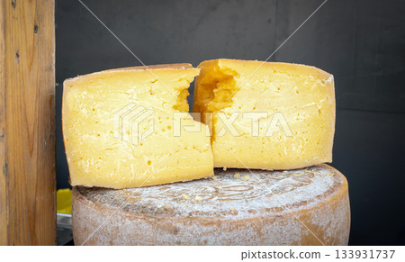Assorted cheese varieties at a market stall Assorted cheese varieties at a market stall 133931737