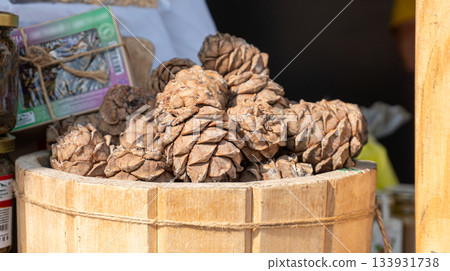 Pine cones in a wooden barrel 133931738