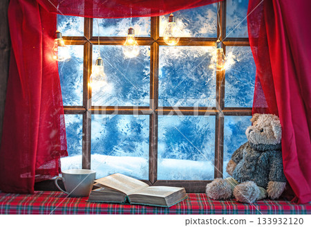 christmas cozy interior background with window sill illuminated with lights and bear toy christmas cozy interior background with window sill illuminated with lights and bear toy 133932120