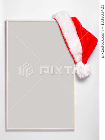 An empty record frame with a Santa hat. The concept of planning for the new year. An empty record frame with a Santa hat. The concept of planning for the new year. 133933423