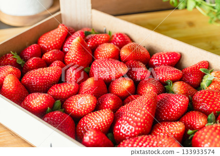 Fresh organic strawberries in wooden box Fresh organic strawberries in wooden box 133933574