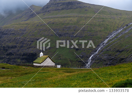 A scenic view of the village of Saksun in the Faroe Islands, featuring traditional houses A scenic view of the village of Saksun in the Faroe Islands, featuring traditional houses 133933578