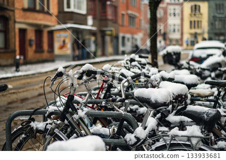 Black bicycle under the snow outside after a snowfall in town. Black bicycle under the snow outside after a snowfall in town. 133933681