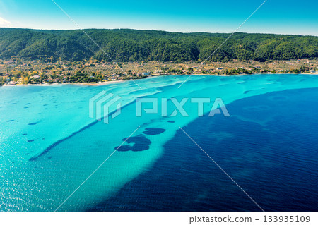 Seascape on a sunny day. Top view of a beautiful bay. Seabed texture in Vourvourou, Greece 133935109