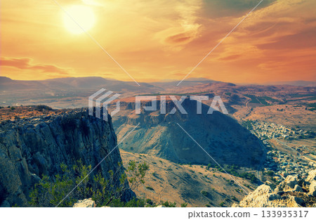 View from Mount Arbel at sunset. Arab village of Wadi Hamam in the valley. Galilee, Israel 133935317