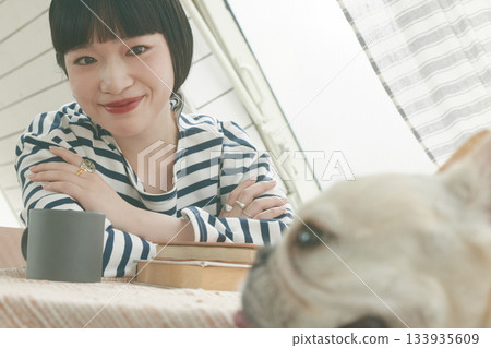 Woman staring at a dog 133935609