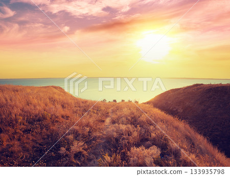 Seascape with clay steep coast. Seashore on a sunny day Seascape with clay steep coast. Seashore on a sunny day 133935798