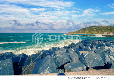 Landscape with sea and cliffs. Rocky seashore on a sunny day. Beautiful nature landscape. Stormy sea. San Sebastian, Basque Country, Spain Landscape with sea and cliffs. Rocky seashore on a sunny day. Beautiful nature landscape. Stormy sea. San Sebastian, Basque Country, Spain 133935840