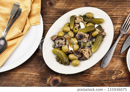 Plate with salty snacks. Plate with salty snacks. 133936075