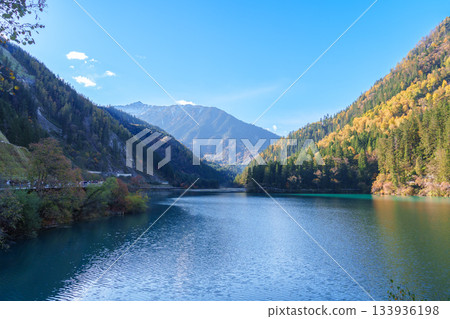 Scenery Jiuzhaigou national park in Sichuan, China. Beautiful of Arrow Bamboo Lake and snow mountain in Autumn season. Famous Landmark and Vacation near Chengdu, China. Asia travel concept Scenery Jiuzhaigou national park in Sichuan, China. Beautiful of Arrow Bamboo Lake and snow mountain in Autumn season. Famous Landmark and Vacation near Chengdu, China. Asia travel concept 133936198