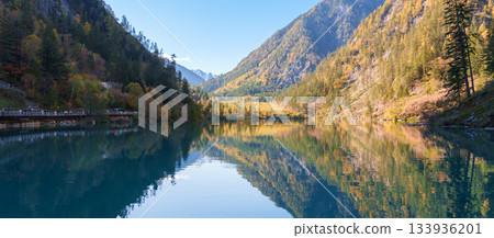 Scenery Jiuzhaigou national park in Sichuan, China. Beautiful of Panda Lake in Autumn season. Famous Landmark and Vacation near Chengdu, China. Asia travel concept Scenery Jiuzhaigou national park in Sichuan, China. Beautiful of Panda Lake in Autumn season. Famous Landmark and Vacation near Chengdu, China. Asia travel concept 133936201