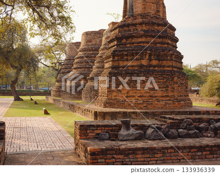 Views of Ayutthaya's ancient Bueng Phra Ram temple and iconic landmarks, showcasing intricate architecture, historical ruins, and cultural heritage in serene atmosphere of UNESCO World Heritage site. Views of Ayutthaya's ancient Bueng Phra Ram temple and iconic landmarks, showcasing intricate architecture, historical ruins, and cultural heritage in serene atmosphere of UNESCO World Heritage site. 133936339