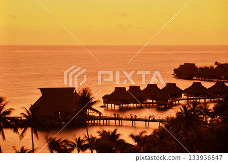 Sunset view of the water cottages on Bora Bora, Tahiti 133936847