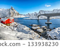 Winter view on Hamnoy village and bridge to Olenilsoya island. 133938230