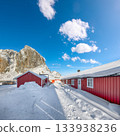 Traditional Norwegian red wooden houses on the shore of  Reinefjorden in Hamnoy village . 133938236