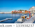 Winter view on Hamnoy village with port and Festhaeltinden mountain on background. 133938237
