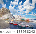 Winter view on Hamnoy village with port and Festhaeltinden mountain on background. 133938242