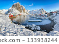 Winter view on Hamnoy village with port and Festhaeltinden mountain on background. 133938244