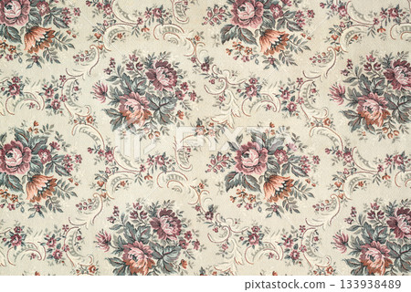 Seamless old-fashioned floral repeated pattern on a tapestry fabric texture biege background. Old retro fashion Seamless old-fashioned floral repeated pattern on a tapestry fabric texture biege background. Old retro fashion 133938489