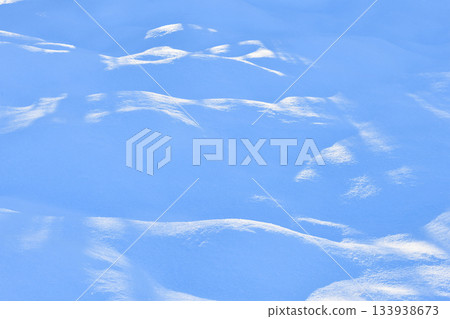 Fresh sparkling blue tone snow close-up, perfect as a tender winter season background texture 133938673