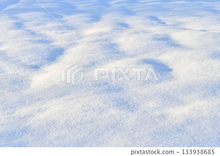 Fresh sparkling snow snowdrifts blue tone close-up, perfect as a winter season sunny day background 133938685