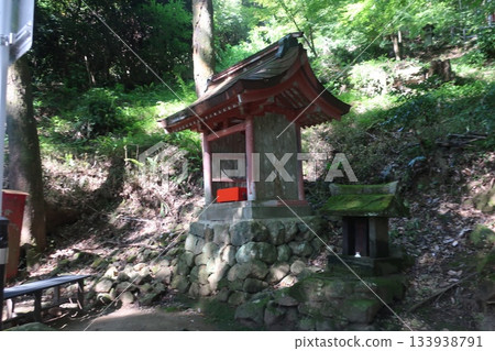 A small shrine surrounded by forest A small shrine surrounded by forest 133938791