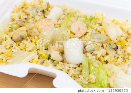 Delicious seafood lettuce fried rice bento 133939223