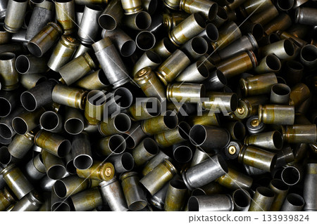Full of Demounted bullet shells set military green background 133939824
