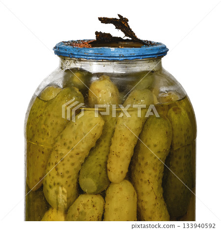 Old pickles in big glass jar with rusted broken tin lid cap in bad condition isolated white background 133940592