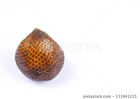 Fresh salak fruit or snake fruit with textured brown skin on white background 133941225