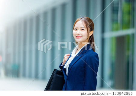 A woman working hard at job hunting 133942895