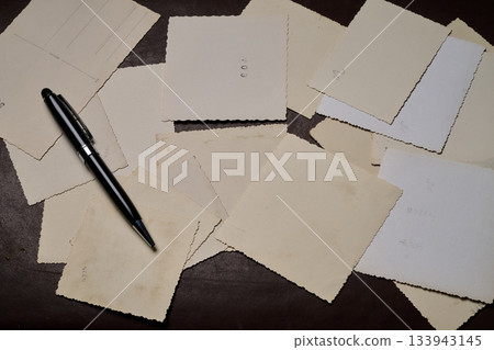 The reverse side of several old photos 133943145