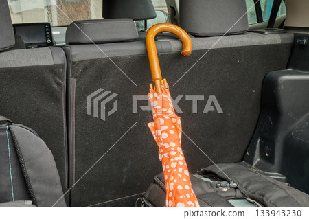 Outdoor. an umbrella in the car trunk 133943230