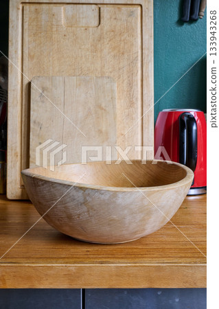 cutting boards and empty salad bowl 133943268