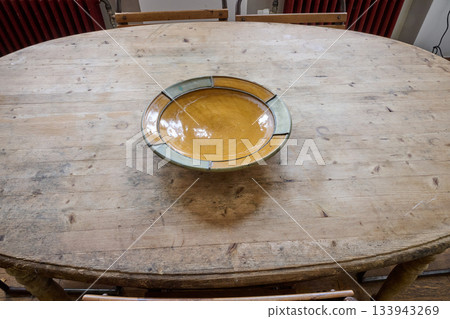 ovale interior table and empty salad bowl 133943269