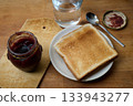 Toasted bread and raspberry jam 133943277