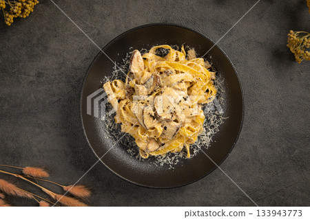 Creamy tagliatelle pasta with mushrooms Creamy tagliatelle pasta with mushrooms 133943773