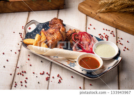 Grilled chicken wings with sauces plate 133943967