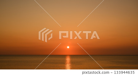 The sun sets on the ocean The sun sets on the ocean 133944635