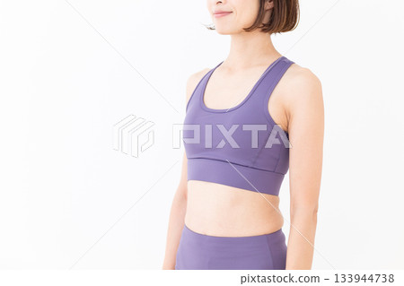 Middle-aged woman in yoga wear Middle-aged woman in yoga wear 133944738