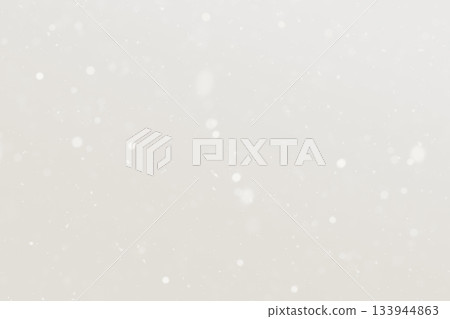 Soft beige snowfall background with gentle light dots for a peaceful winter mood Demonstration Color of the Year 2026 133944863