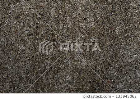 Rough asphalt texture close up with gravel and tiny stones for urban ground background Rough asphalt texture close up with gravel and tiny stones for urban ground background 133945062